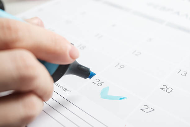 highlighter marks calendar date, health schedule tracking and follow-up planning concept