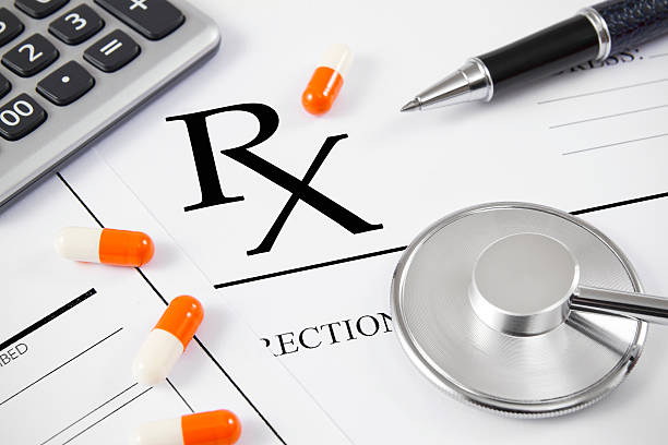Close-up of RX prescription and stethoscope with patient forms. Close-up of RX prescription and stethoscope with patient forms.